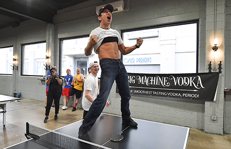 Helio Castroneves on ping pong table