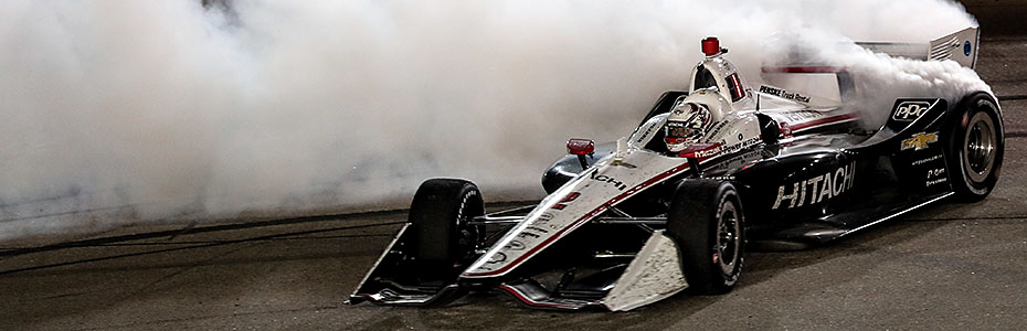 Josef Newgarden celebrates his win with donuts