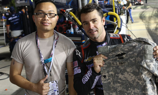 Oriol Servia with National Guard member with Gift