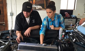 Thumbnail for In the blog: Lauren Bohlander gets a little help from husband Tony Kanaan during filming of 'Garage Squad'