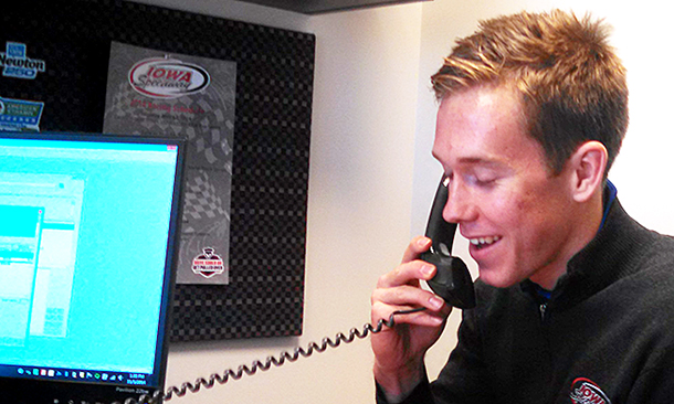 Verizon IndyCar Series driver Jack Hawksworth answers questions from Iowa Speedway ticket holders during his stint in the track's ticket office