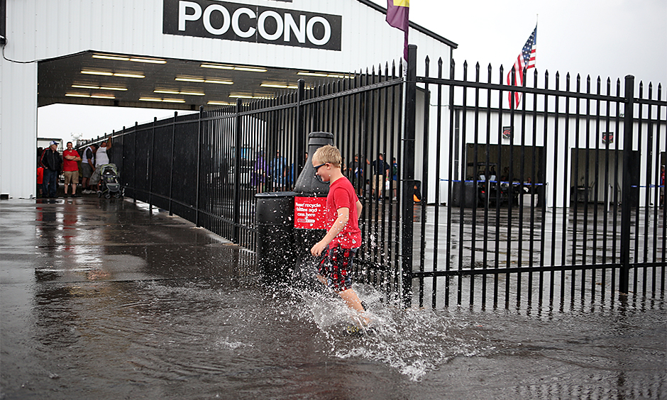 Pocono fan splashes puddle