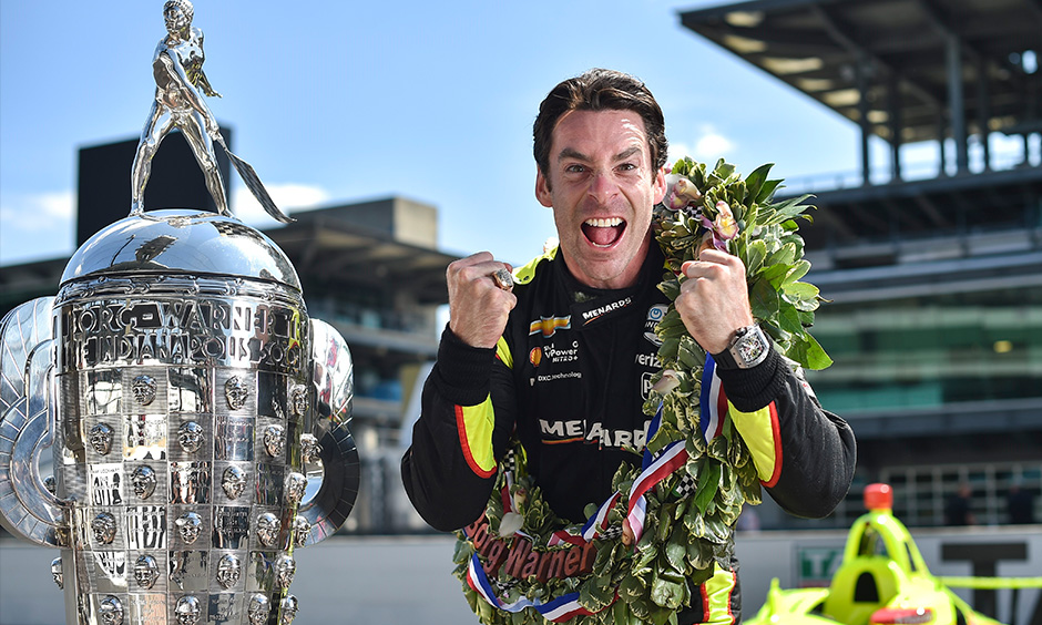 Simon Pagenaud with Borg-Warner Trophy on IMS yard of bricks