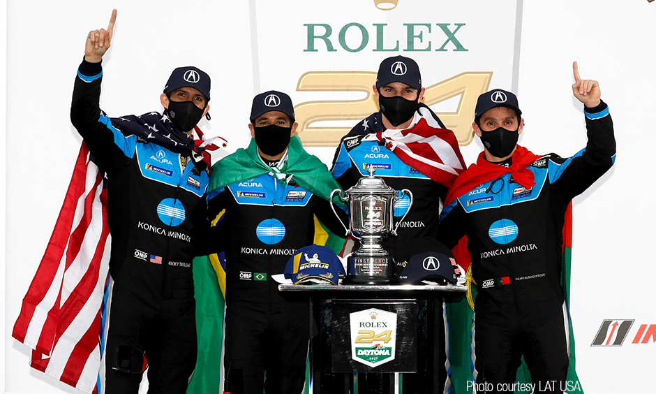 Alexander Rossi and Helio Castroneves with their Wayne Taylor Racing teammates.